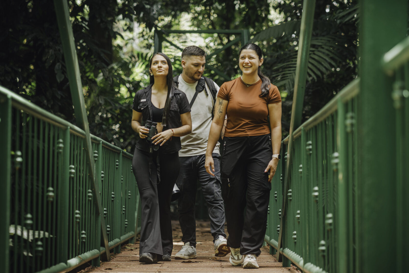 Group of hikers exploring lush rainforest on a guided nature trail in La Fortuna