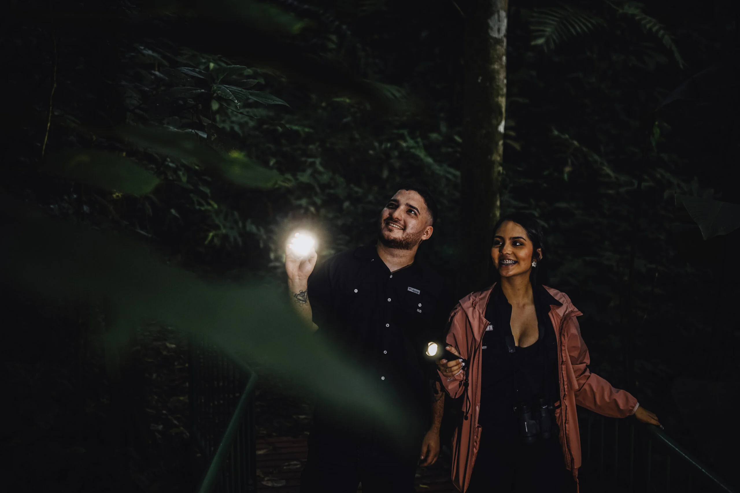 Group on a guided La Fortuna night nature walk exploring rainforest trails