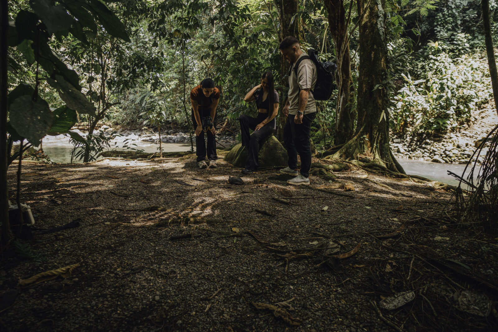 Tour guide setting up optical equipment on an Arenal hiking trail